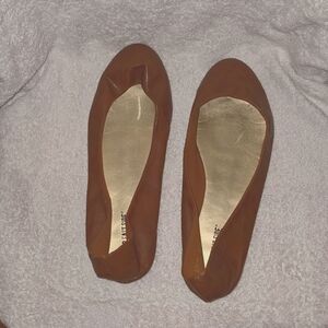 Brown leather flats by lower east side.